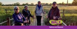 ladies holding walking poles