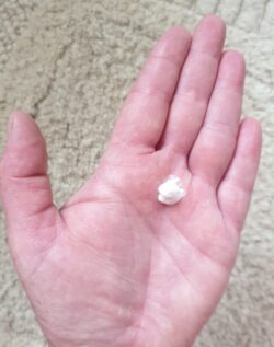 A hand, with a small amount of lotion applied